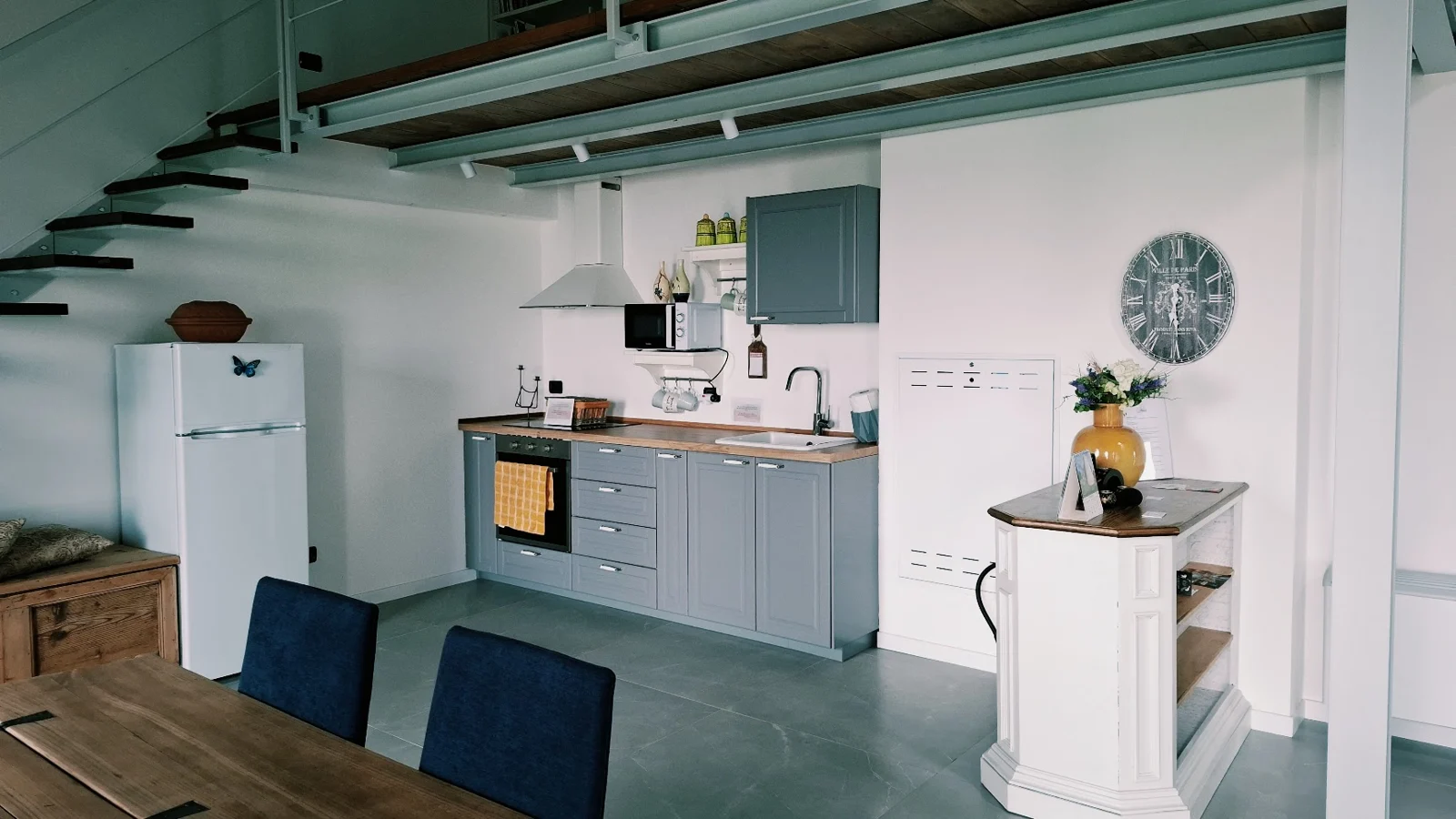 Deltasol shared kitchen with light and green cabinetry